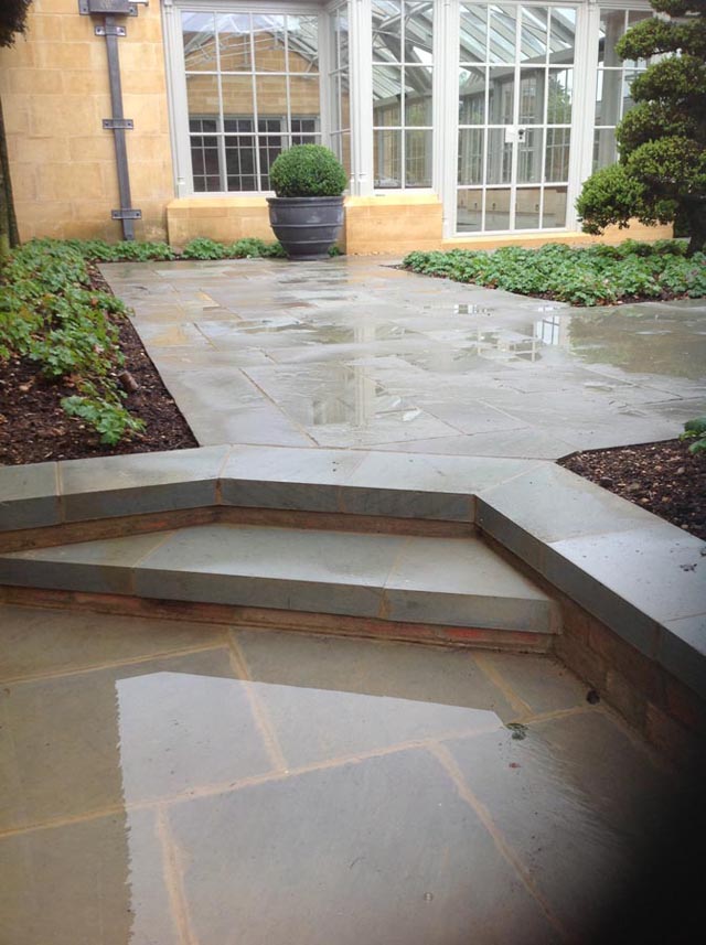 Exterior flagstone flooring on patio and steps