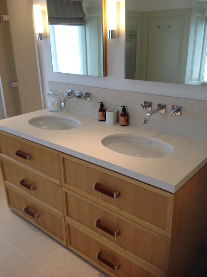 Marble bathroom basins with matching marble splashbacks