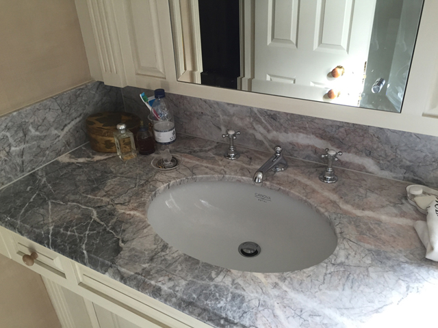 Marble bathroom basin and matching marble wall tiles